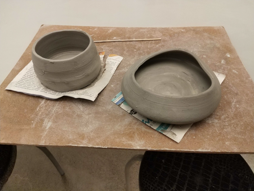 2 pieces of unfired pottery