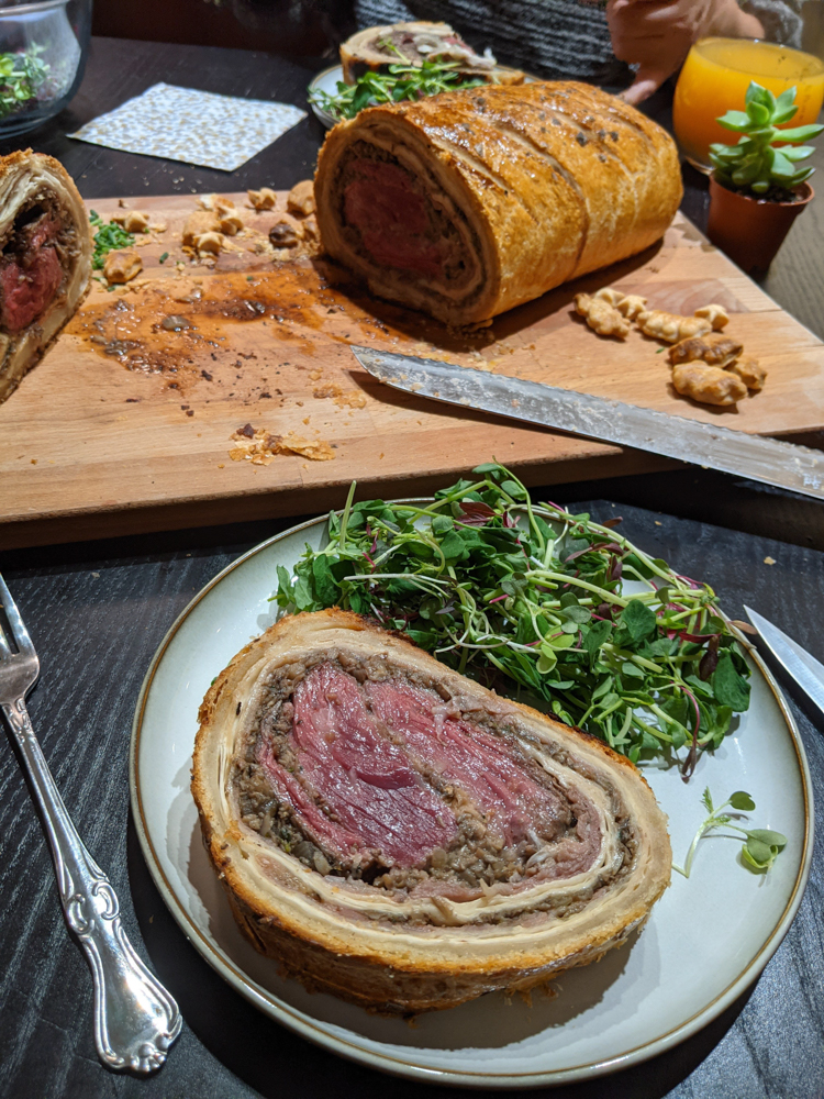 beef wellington cross section with salad