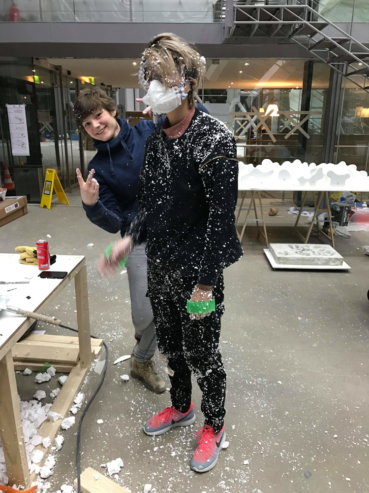 me coming out of the architectural model, covered in styrofoam with friend posing behind me