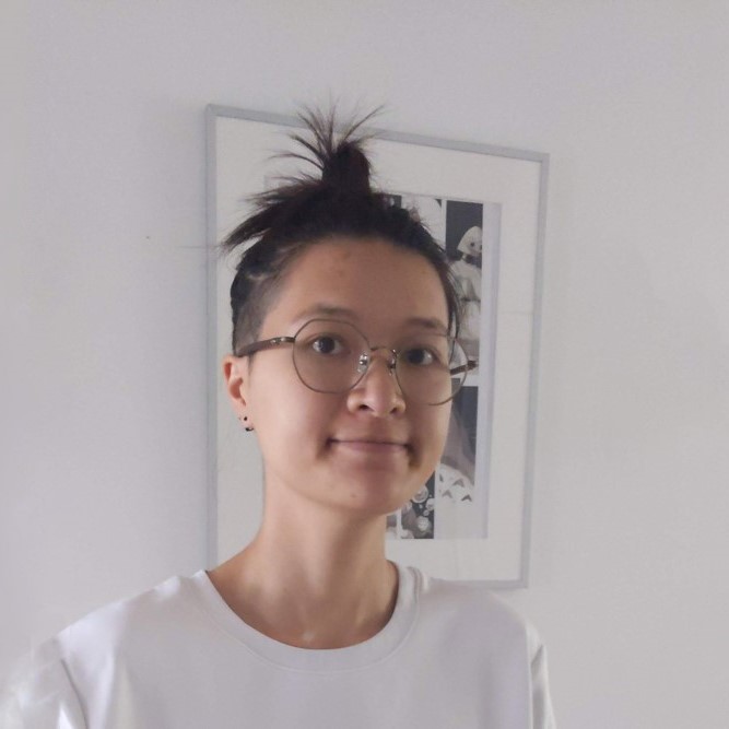 round portrait, hair tied in a topknot, white background